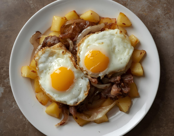 Huevos rotos con secreto iberico plato